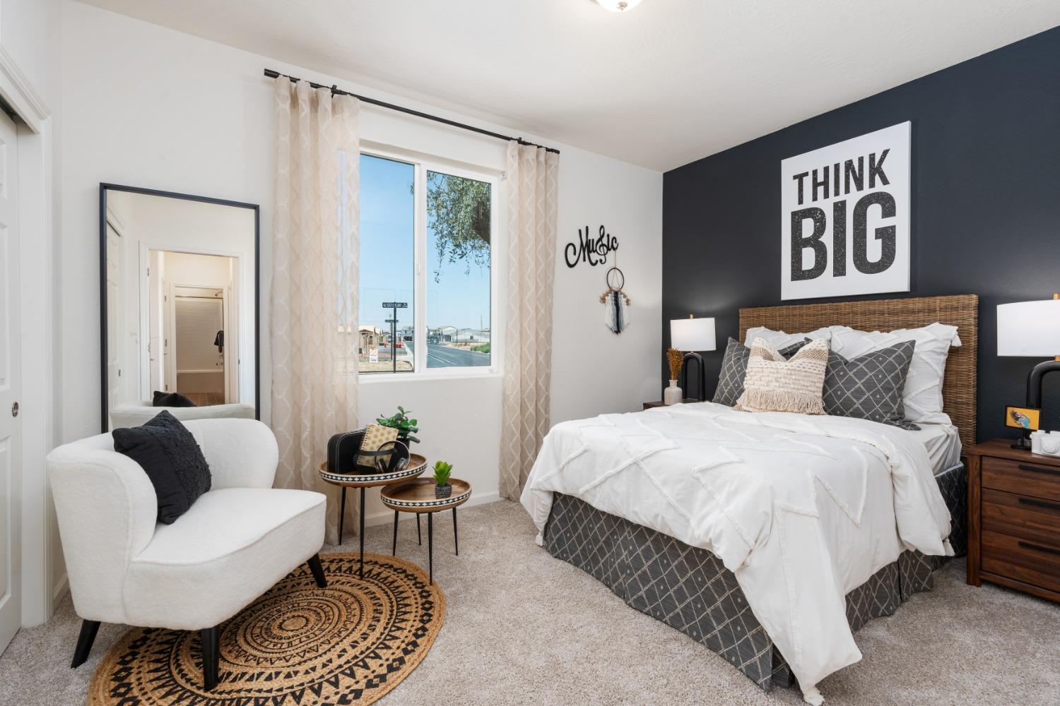 1601 Bloom Avenue Clovis, CA 93619 - Photo 19 of 28 a bedroom with a bed and a couch