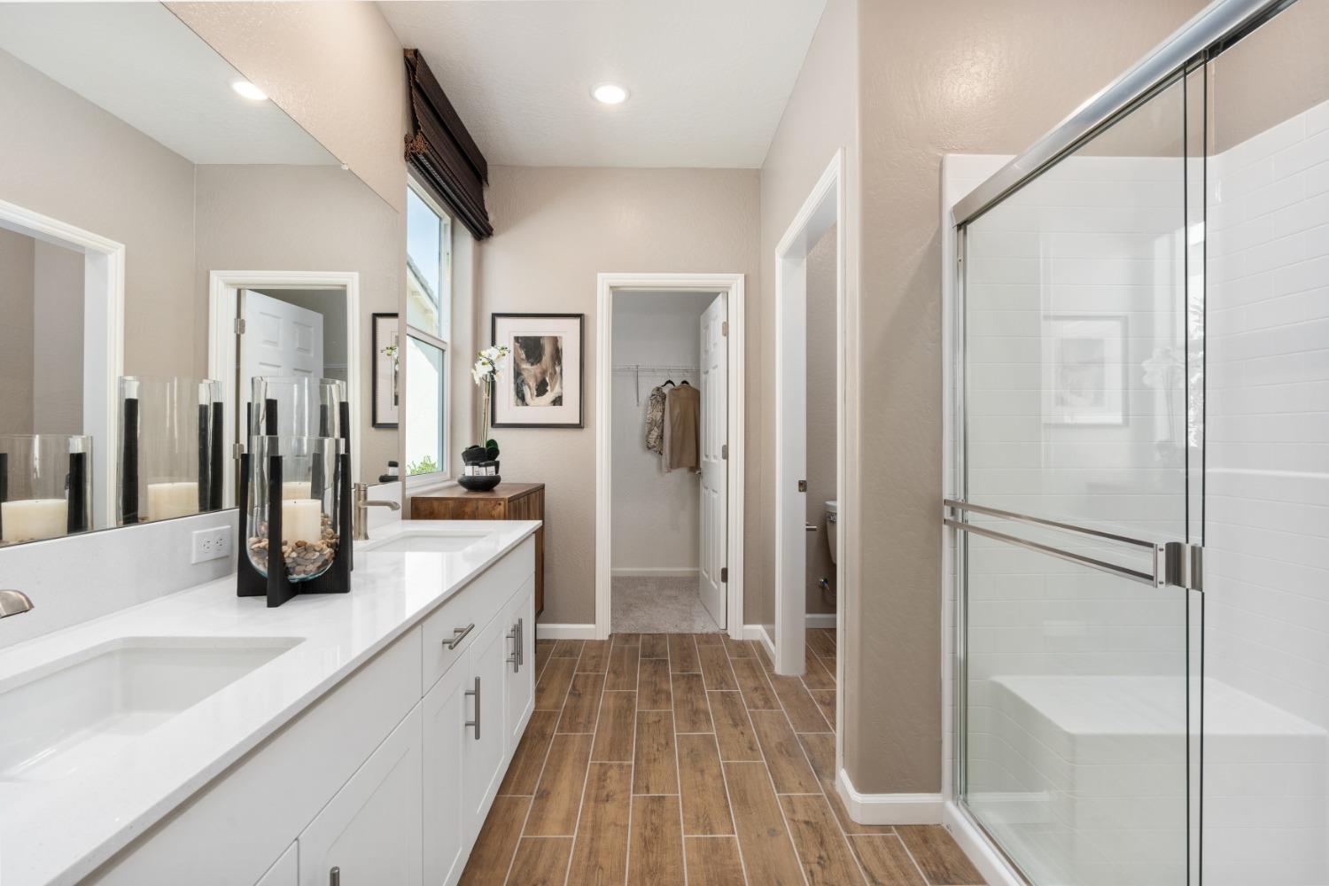 1601 Bloom Avenue Clovis, CA 93619 - Photo 25 of 28 a bathroom with a sink a mirror and a shower