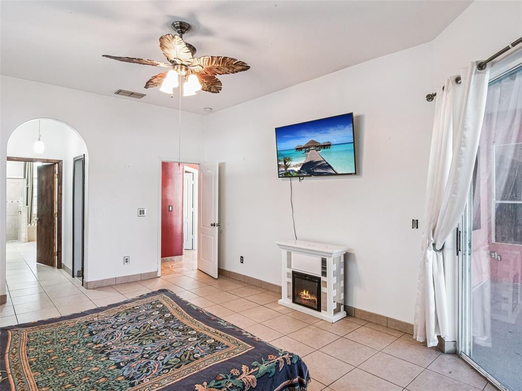 9101 Lake Coventry Court Gotha, FL 34734 - Photo 18 of 45 a view of a livingroom with a chandelier fan and wooden floor