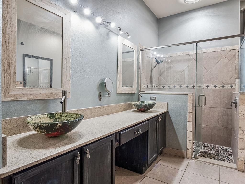 9101 Lake Coventry Court Gotha, FL 34734 - Photo 24 of 45 a bathroom with a sink and a mirror