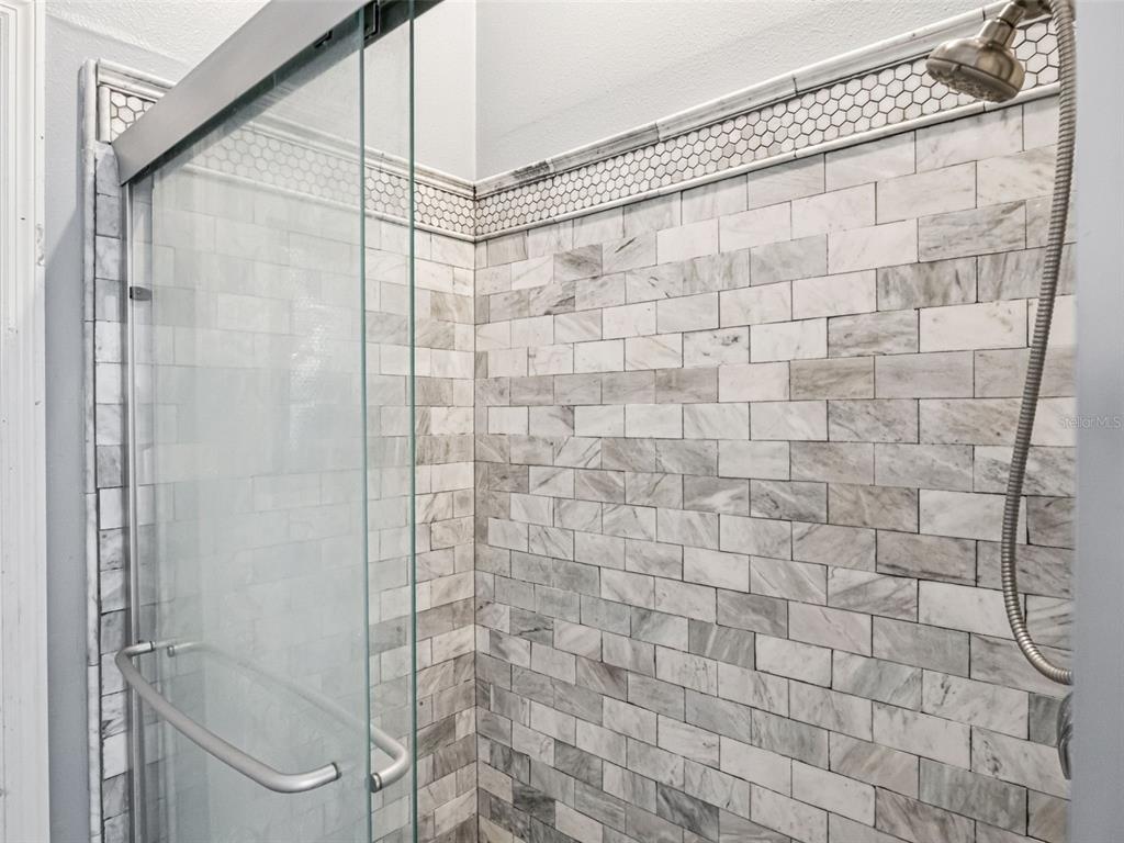 9101 Lake Coventry Court Gotha, FL 34734 - Photo 25 of 45 a bathroom with a shower