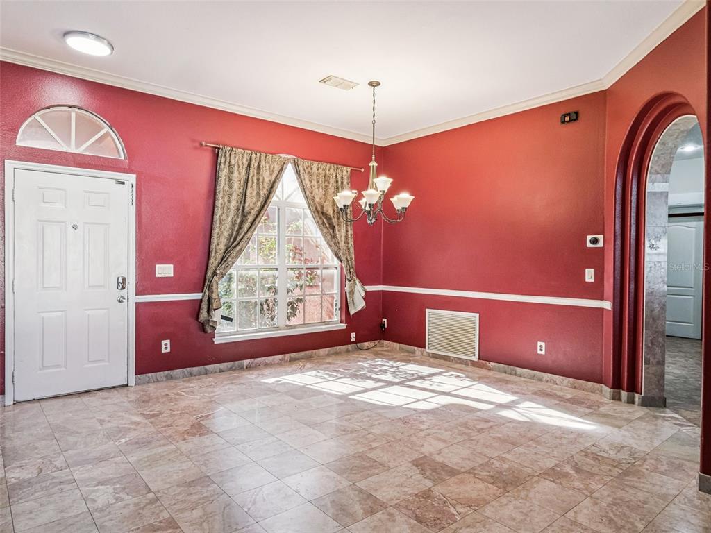 9101 Lake Coventry Court Gotha, FL 34734 - Photo 3 of 45 a view of a livingroom with a chandelier fan and a window