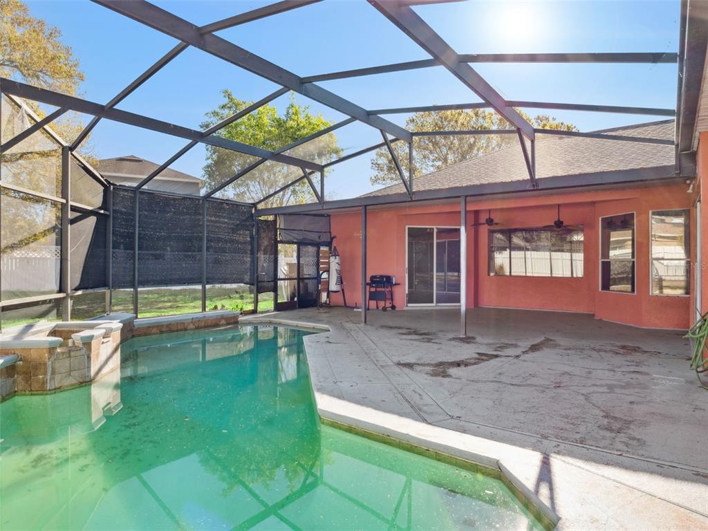 9101 Lake Coventry Court Gotha, FL 34734 - Photo 31 of 45 a view of a backyard with a swimming pool