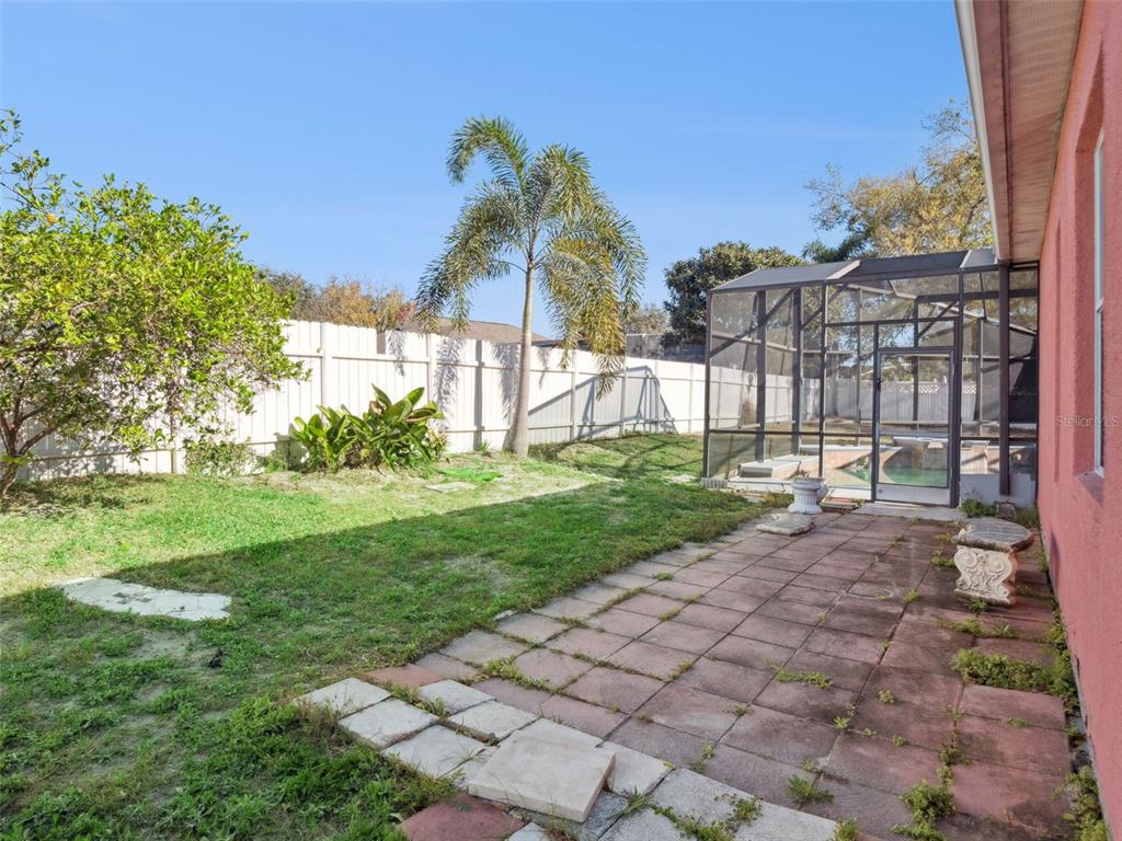 9101 Lake Coventry Court Gotha, FL 34734 - Photo 33 of 45 a view of a backyard with a garden