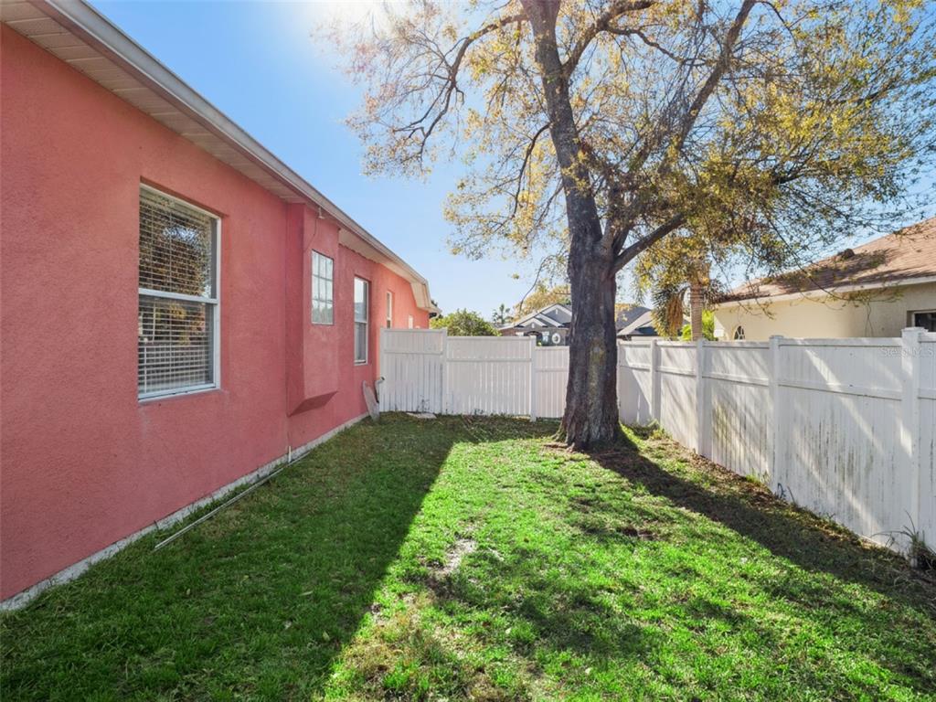 9101 Lake Coventry Court Gotha, FL 34734 - Photo 35 of 45 a backyard of a house with lots of green space