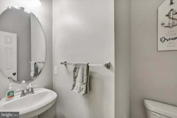 a bathroom with a sink and mirror