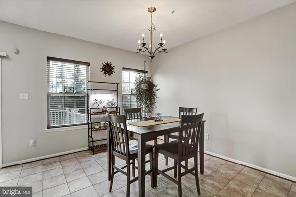 a view of a dining room with furniture and window