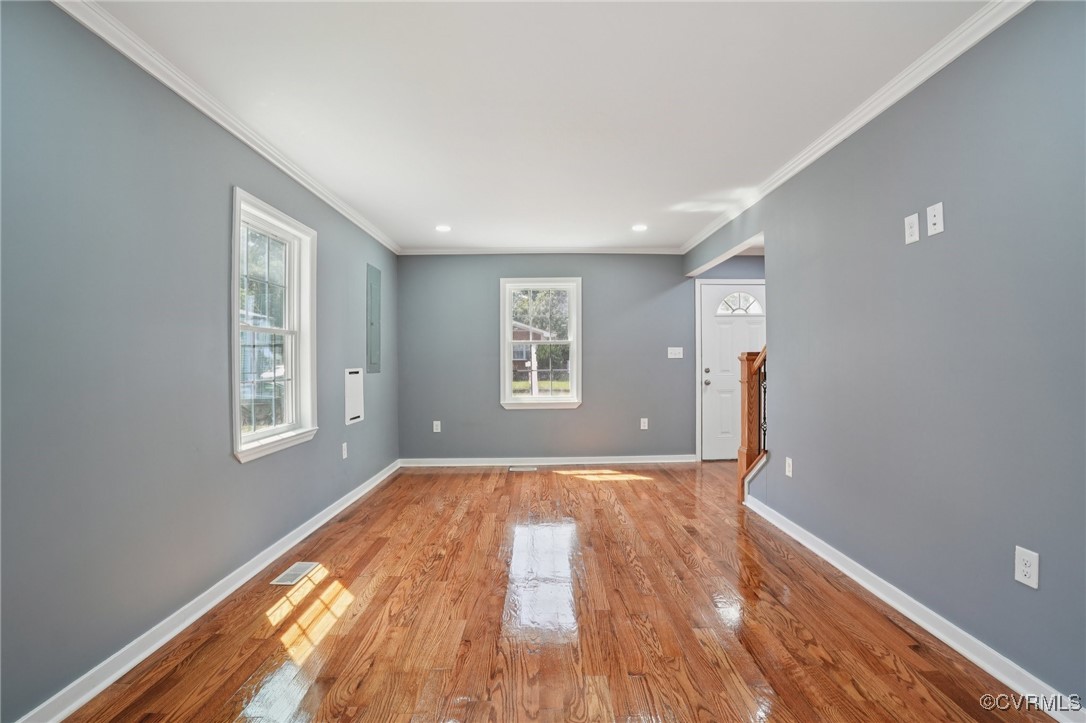 1133 Rome Street Petersburg, VA 23803 - Photo 11 of 33 Empty room with light wood-type flooring, crown mo