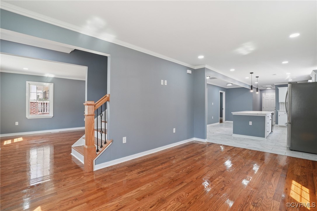 1133 Rome Street Petersburg, VA 23803 - Photo 13 of 33 Unfurnished living room featuring stairs, light wo