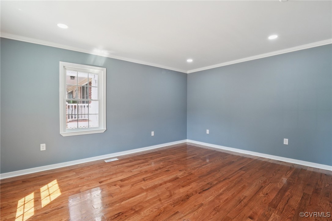1133 Rome Street Petersburg, VA 23803 - Photo 16 of 33 Empty room with ornamental molding, wood finished