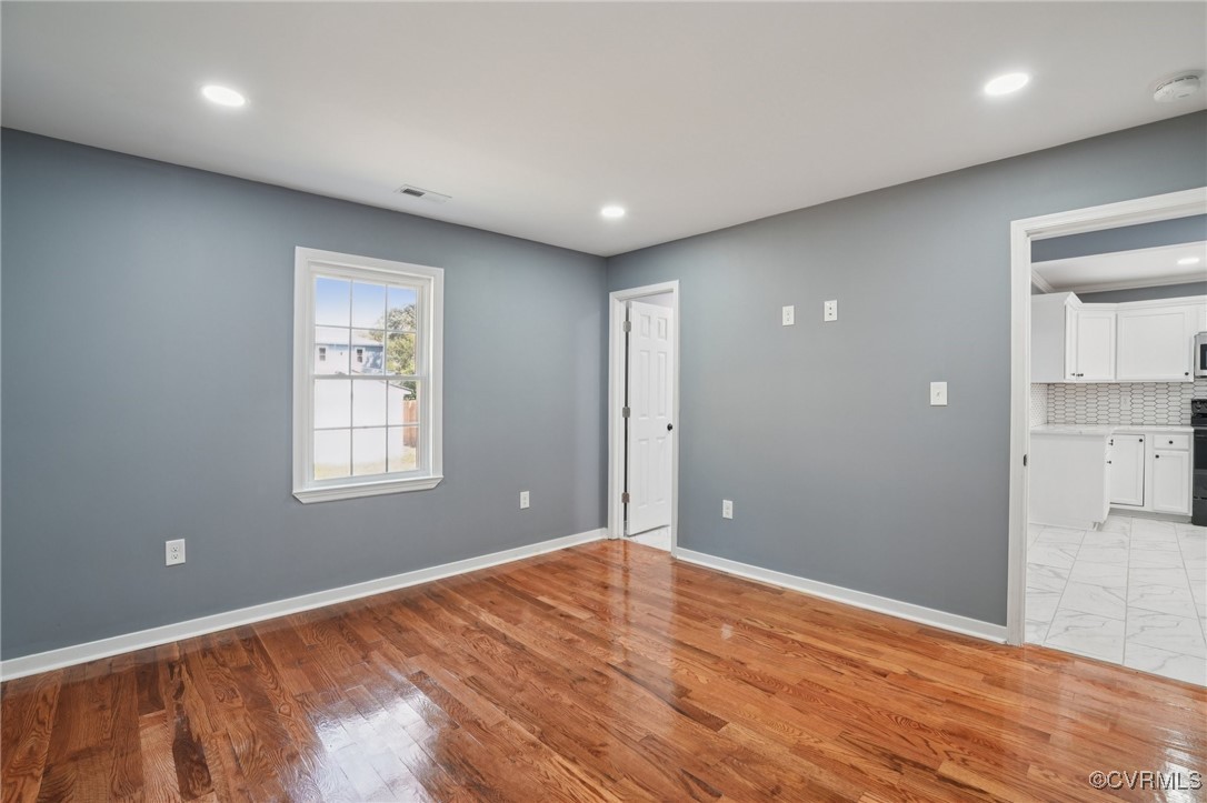 1133 Rome Street Petersburg, VA 23803 - Photo 18 of 33 Spare room with recessed lighting, light wood-styl