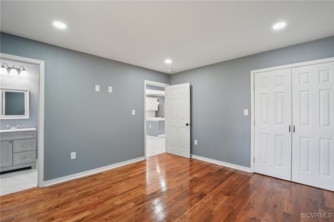 1133 Rome Street Petersburg, VA 23803 - Photo 19 of 33 Unfurnished bedroom featuring wood finished floors