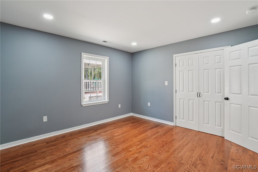 1133 Rome Street Petersburg, VA 23803 - Photo 22 of 33 Unfurnished bedroom featuring wood finished floors