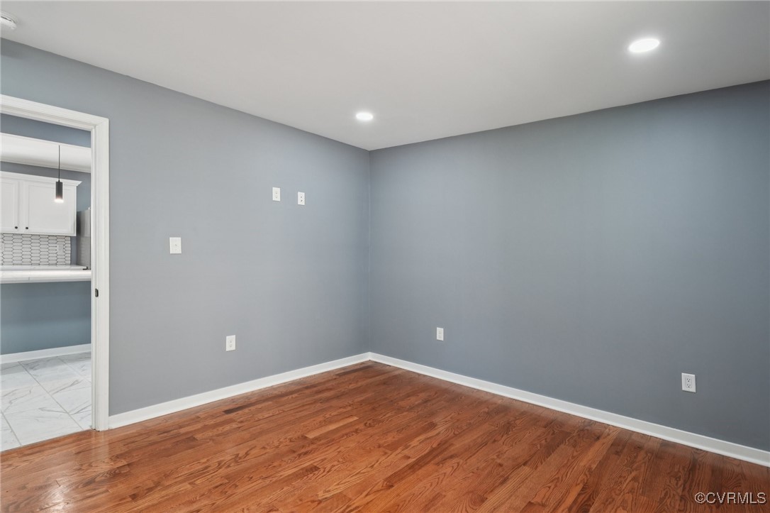 1133 Rome Street Petersburg, VA 23803 - Photo 24 of 33 Spare room with light wood-style floors and recess