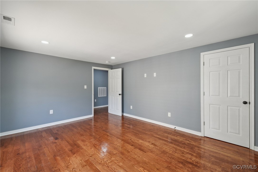 1133 Rome Street Petersburg, VA 23803 - Photo 29 of 33 Empty room featuring wood finished floors and rece