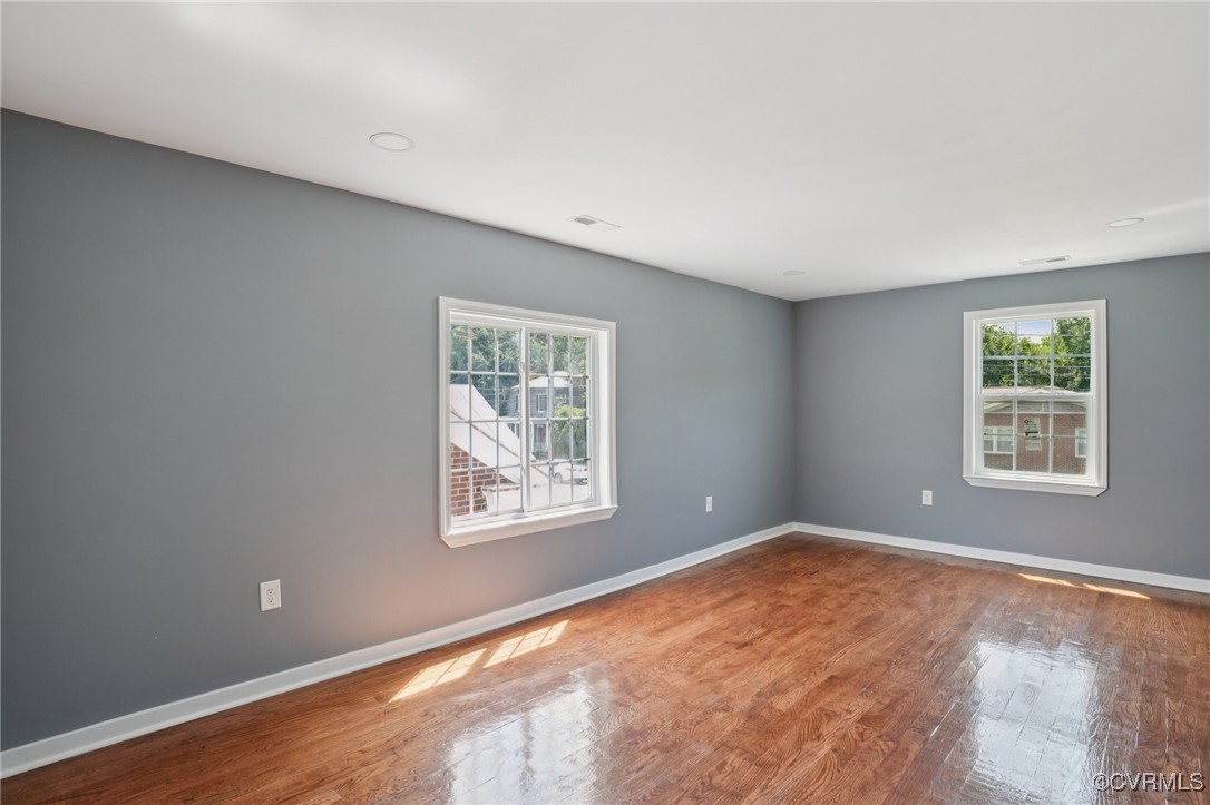 1133 Rome Street Petersburg, VA 23803 - Photo 31 of 33 Spare room with plenty of natural light and wood f