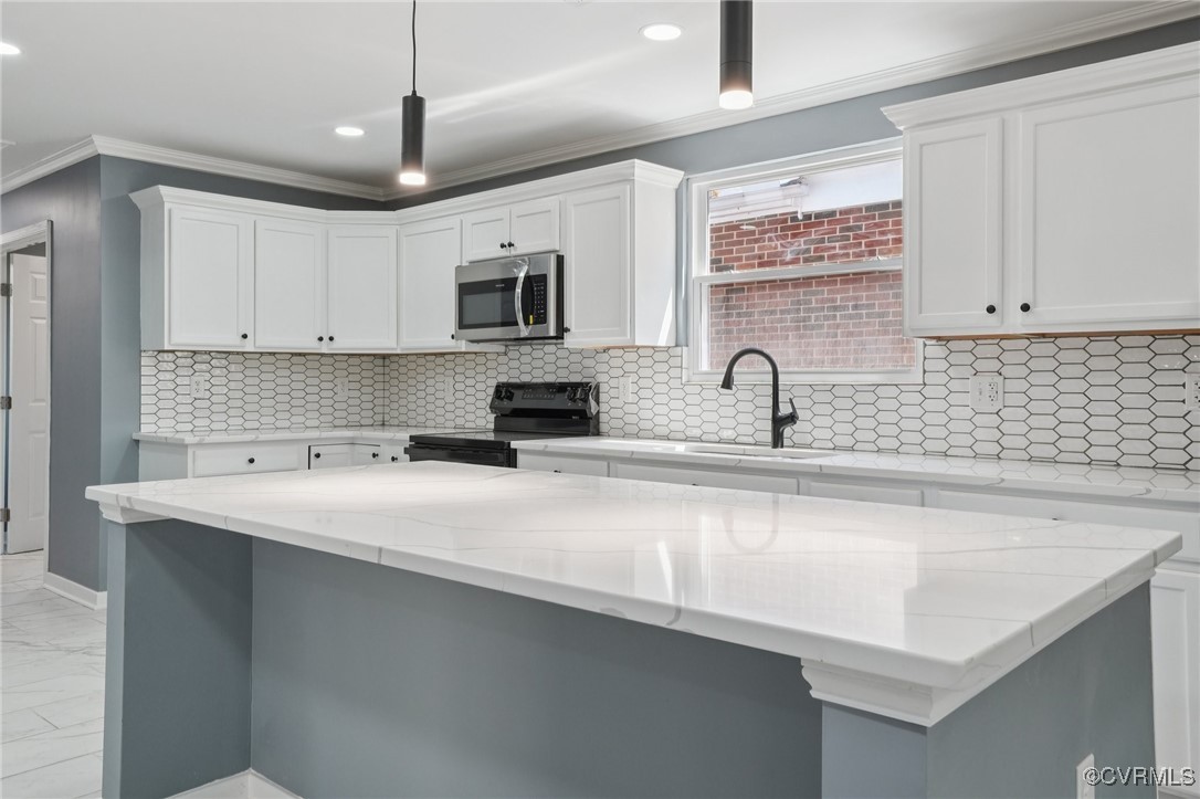 1133 Rome Street Petersburg, VA 23803 - Photo 5 of 33 Kitchen featuring white cabinets, black electric r