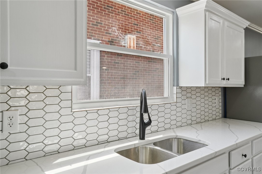 1133 Rome Street Petersburg, VA 23803 - Photo 6 of 33 Kitchen with white cabinetry, backsplash, light st