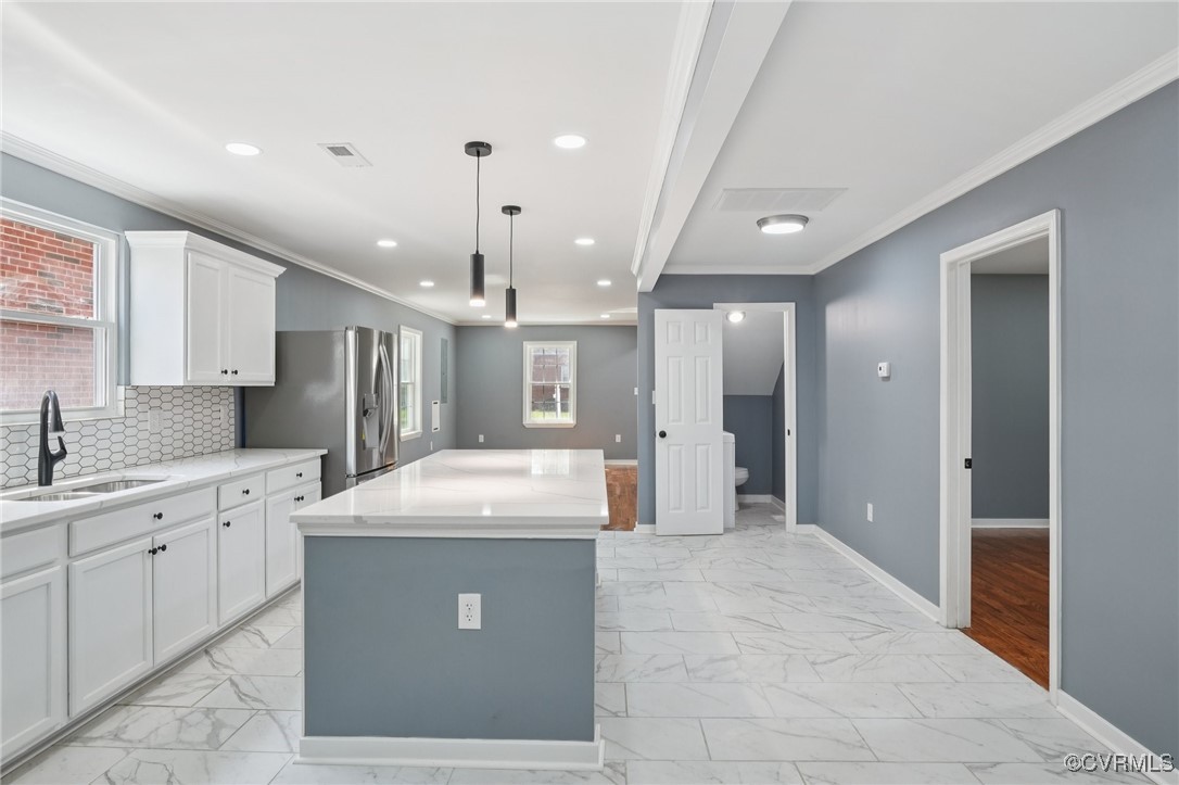 1133 Rome Street Petersburg, VA 23803 - Photo 7 of 33 Kitchen with light marble finish floors, white cab