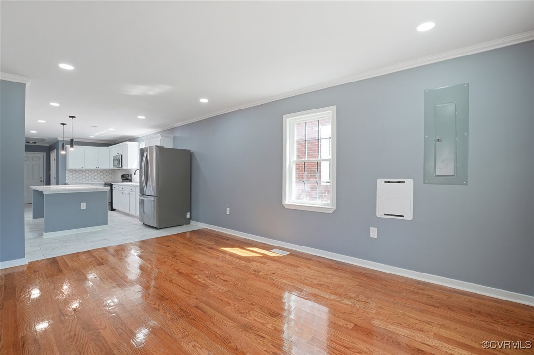 1133 Rome Street Petersburg, VA 23803 - Photo 10 of 33 Unfurnished living room featuring ornamental moldi