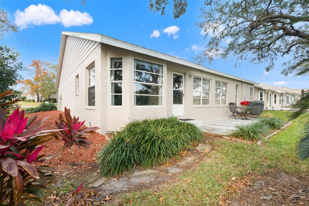 7354 Woodhollow Road Spring Hill, FL 34606 - Photo 34 of 47 a front view of a house with a yard