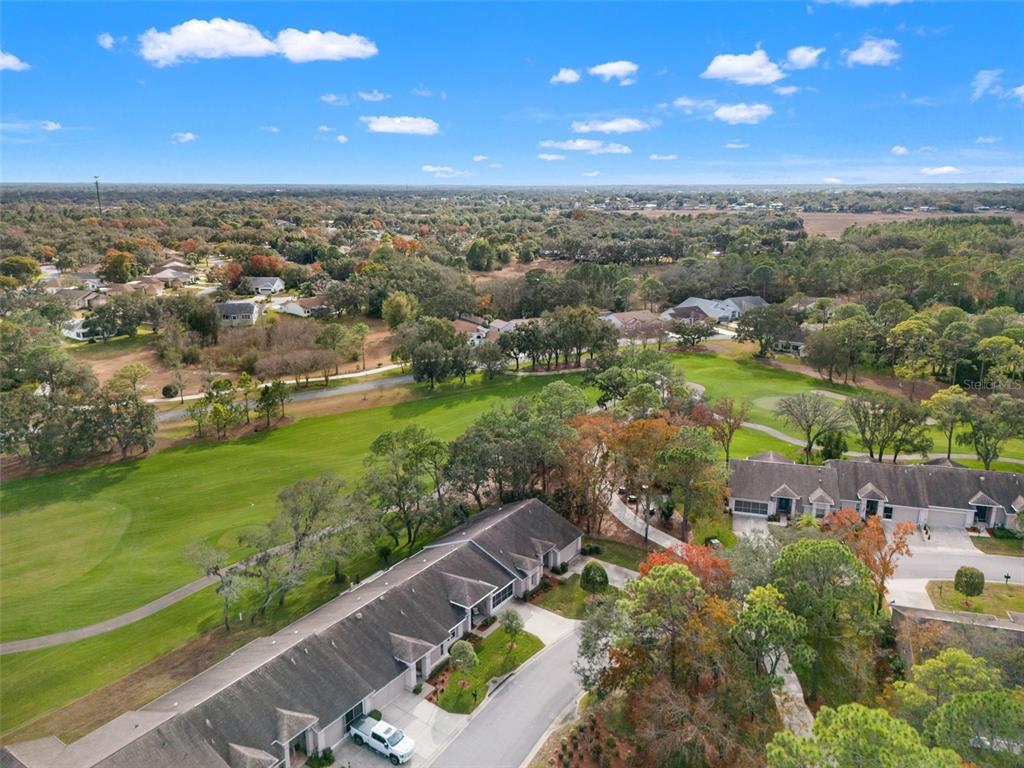 7354 Woodhollow Road Spring Hill, FL 34606 - Photo 44 of 47 an aerial view of multiple house