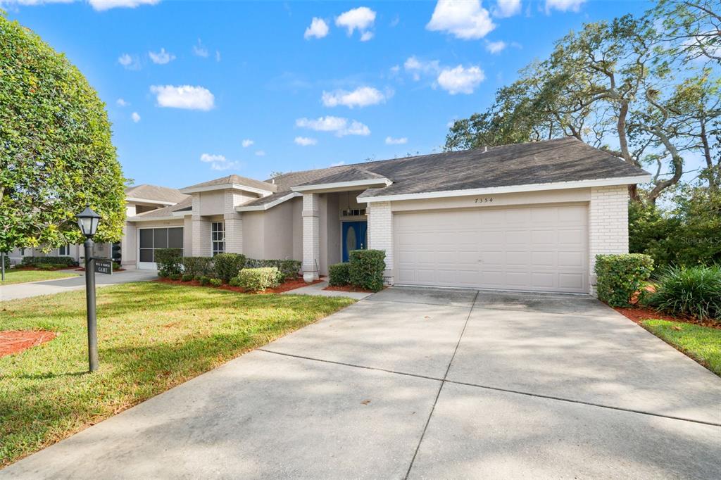 7354 Woodhollow Road Spring Hill, FL 34606 - Photo 5 of 47 a house view with a backyard space