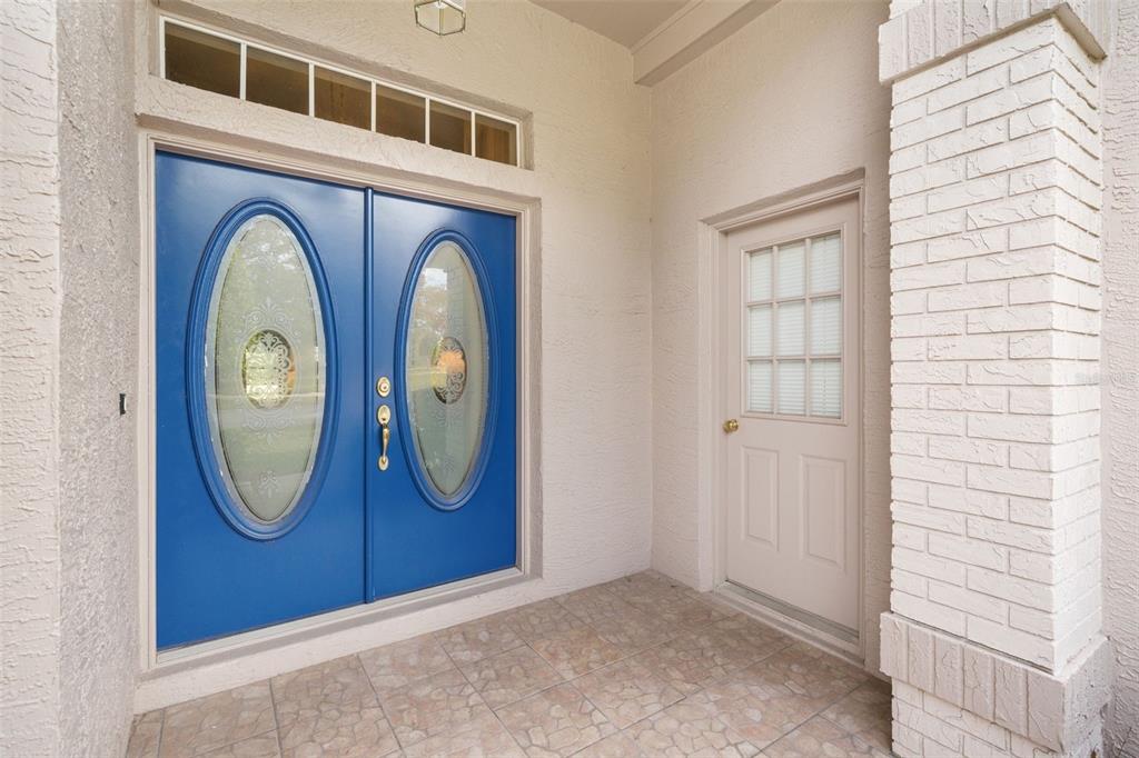 7354 Woodhollow Road Spring Hill, FL 34606 - Photo 6 of 47 a front view of a house with garden