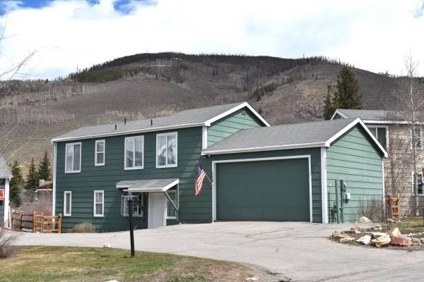 772 Alpine Road Dillon, CO 80435 - Photo 12 of 24 a front view of a house with a yard and garage
