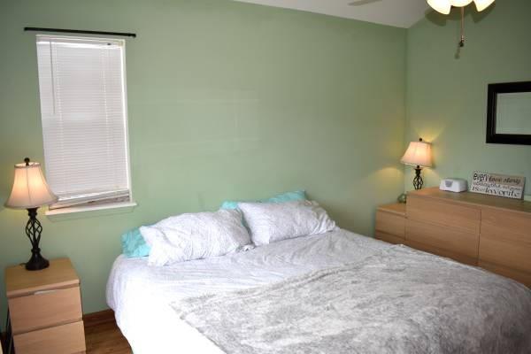 772 Alpine Road Dillon, CO 80435 - Photo 15 of 24 a bedroom with a bed and a lamp