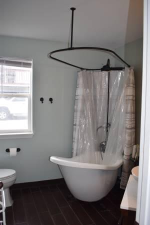 772 Alpine Road Dillon, CO 80435 - Photo 17 of 24 a bathroom with a bathtub and a window