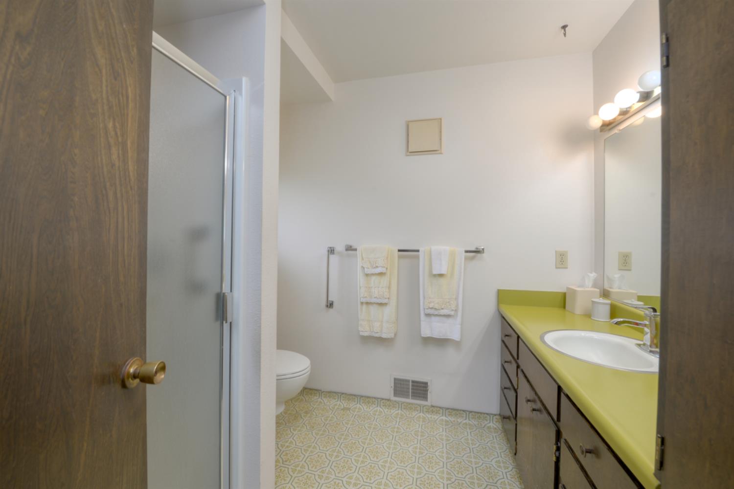 1471 Highway 33 Gustine, CA 95322 - Photo 20 of 57 a spacious bathroom with a granite countertop sink a toilet and shower