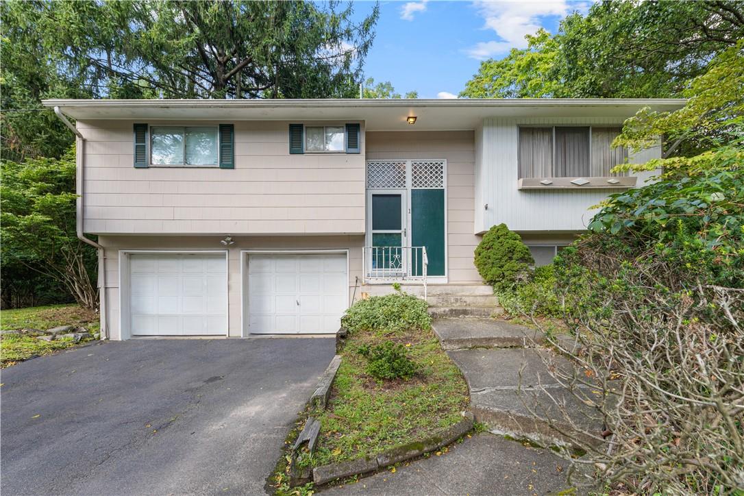 1 Madeline Terrace Spring Valley, NY 10977 - Photo 1 of 1 a front view of a house with a garden