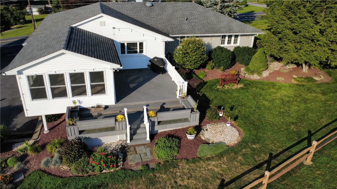 3285 Cherryville Road Northampton, PA 18067 - Photo 47 of 51 Multi-level wooden decking overlooks a beautifully landscaped lawn and garden beds.