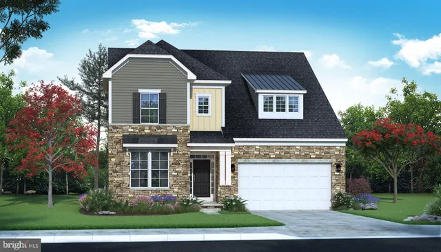 an aerial view of a house with garden space and ocean view