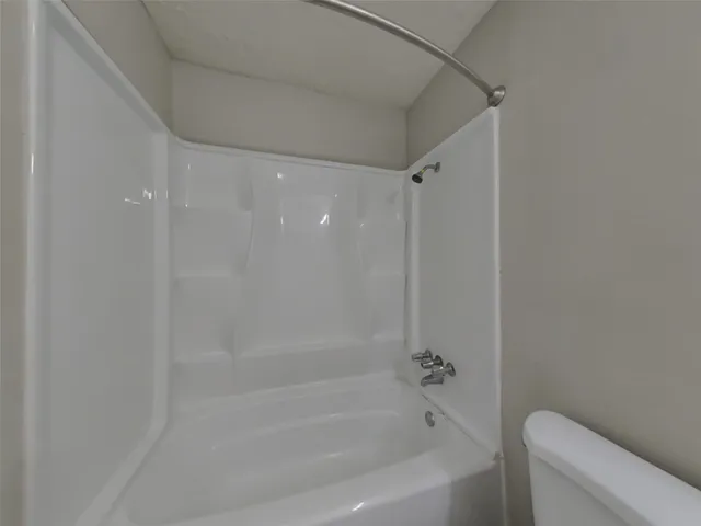 a close up of a bathtub curtain