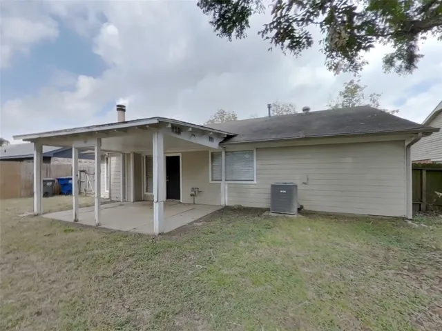 front view of a house with a garden