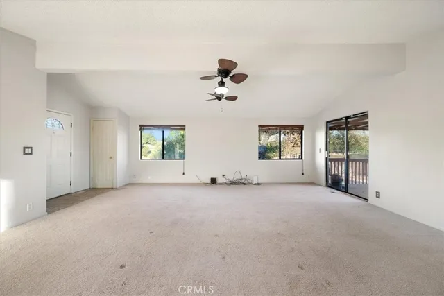 a view of a kitchen with cabinet and a bathtub
