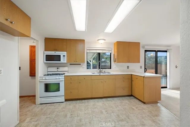 a large bathroom with a tub a sink and mirror