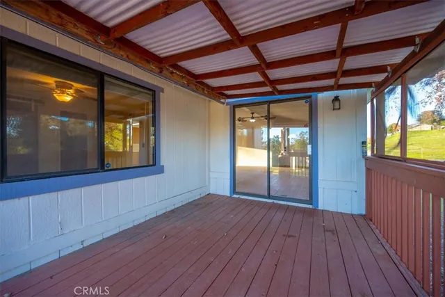 a front view of a house with a garden and yard
