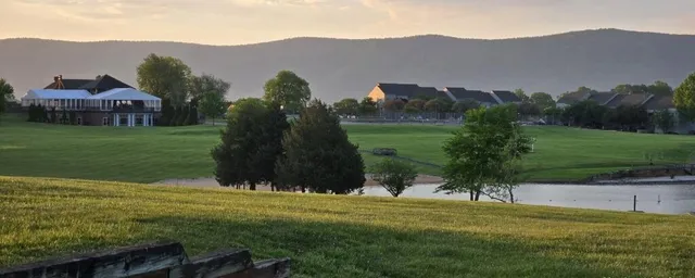 a view of a town with mountains in the background