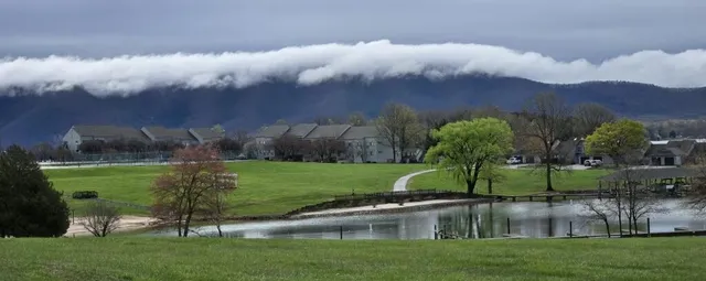 a view of a big house with a big yard