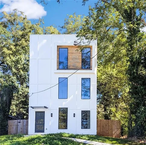 front view of a house with a tree