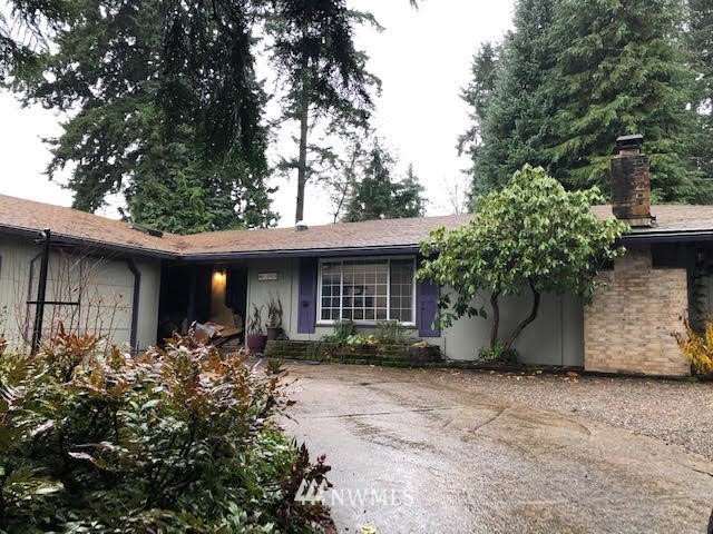 4909 Southeast 2nd Street Renton, WA 98059 - Photo 1 of 1 a front view of a house with a yard and trees