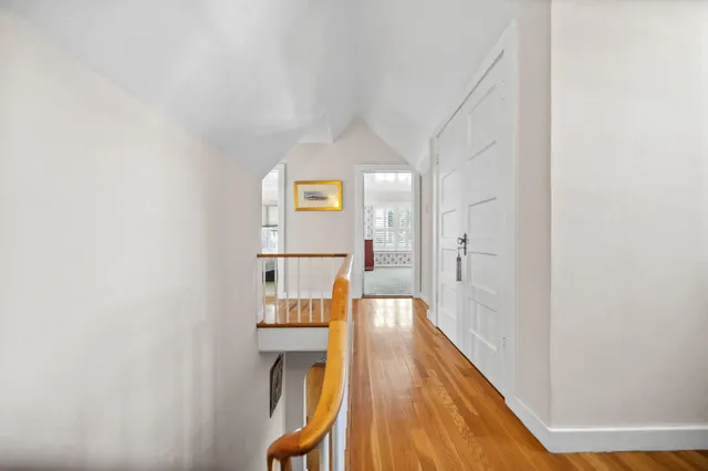 a view of a living room with wooden floor