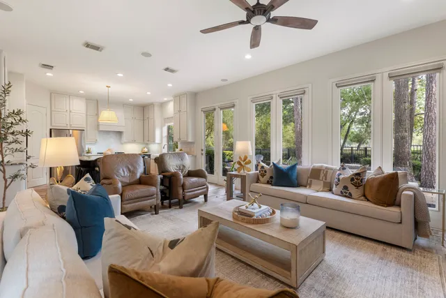 a living room with furniture or couches and a large window