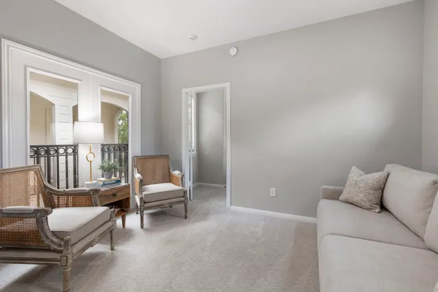 a bedroom with furniture and wooden floor