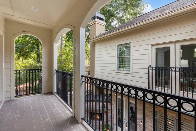 a view of a house with wooden deck