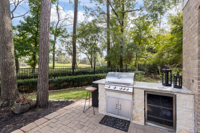 a view of a kitchen with a stove and a fire pit