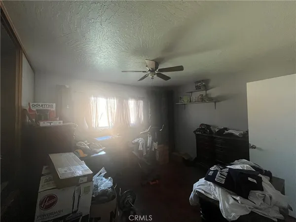 a room with gym equipment and a window